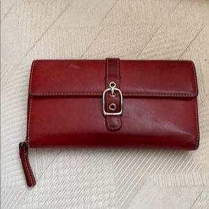 Coach wallet beautiful and has many compartments.